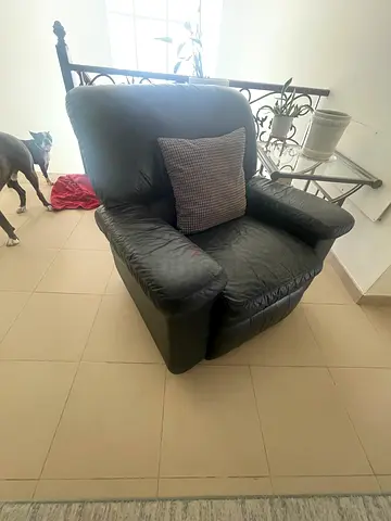 Used dark leather armchair in good condition