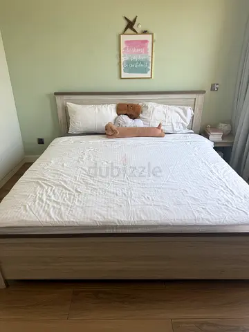 King size bed with mattress and mattress topper.
