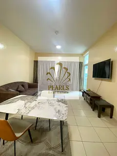 Furnished two-bedroom apartment with a living room available for annual rent in Ajman One Towers, Al