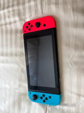 Nintendo Switch (Neon Red & Blue) - Console and case, Good Working Condition comes with games