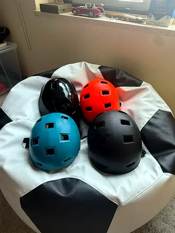 Set of 4 skate/scooter helmets — various colors, used