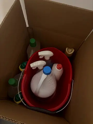 Cleaning supplies bundle with mop bucket and detergent bottles
