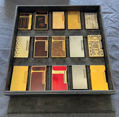 Collection of 15 Vintage S.T. Dupont Style Table Lighters in Display Case