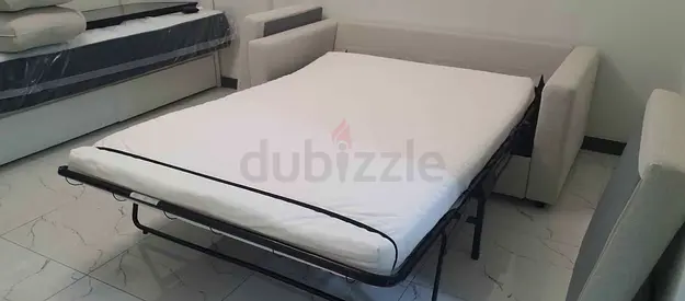 Light beige fabric sofa bed with mattress good condition
