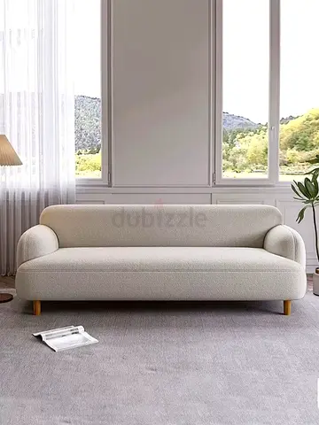 3-seater cream boucle sofa with wooden legs
