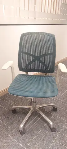 Used ergonomic mesh office chair with swivel and armrests