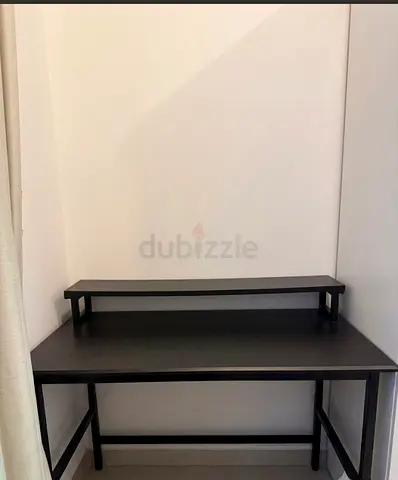 Compact black Gaming desk with raised monitor shelf