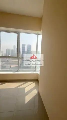 Two-bedroom apartment with a living room and an open view in Al-Taawun.