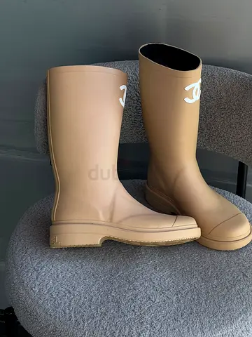 Beige knee-high rubber rain boots with logo