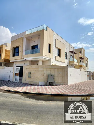 For rent in Al Yasmin area: 5 master bedrooms, living room, 2 lounges, roof terrace, large yard, main street, super deluxe finishing