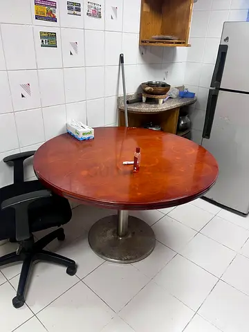 Round wooden dining table with an office chair - good condition