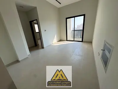 First-time occupancy: 1 bedroom, living room, 2 bathrooms, central A/C, and balcony. Located near all amenities with easy access to Sharjah and Dubai.