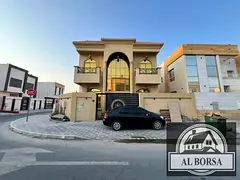 Corner villa for rent in Al Yasmeen, Ajman: 5 bedrooms, a majlis, a living area, a spacious kitchen,