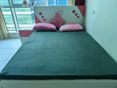 Double bed with pink headboard and bedside drawer, good condition