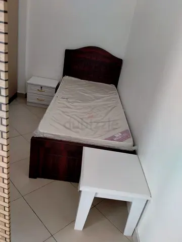 Single wooden bed