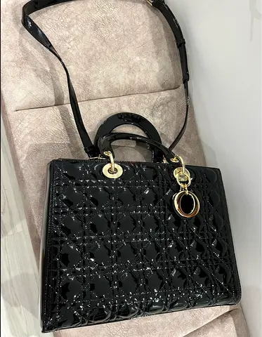 Copy a Black patent leather shoulder bag with gold hardware