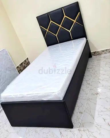 Single bed with upholstered headboard and new mattress — black
