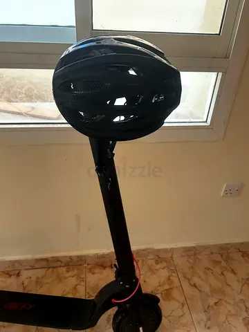 Used electric scooter with helmet included