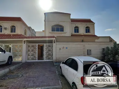 For rent a villa i in Ajman, 5 master bedrooms, a majlis, a hall, a maid's room, and a store