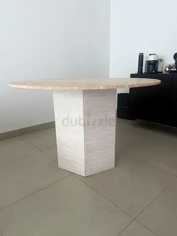 Round traventine dining table
