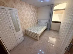 Room with a partition in Al Muwaihat 3.