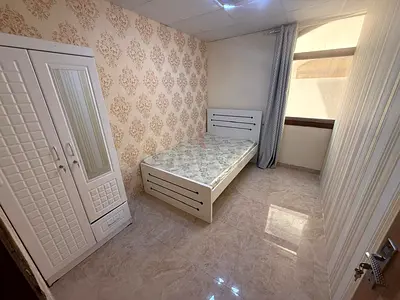 Room with a partition in Al Muwaihat 3.