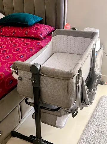 Side-sleeper bedside bassinet in grey - adjustable height, used