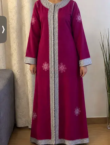 Elegant Moroccan kaftan with beautiful traditional embroidery. Perfect for special occasions.