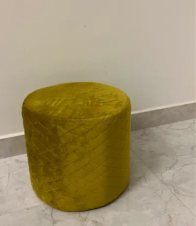 Small round olive-green velvet pouf/ottoman