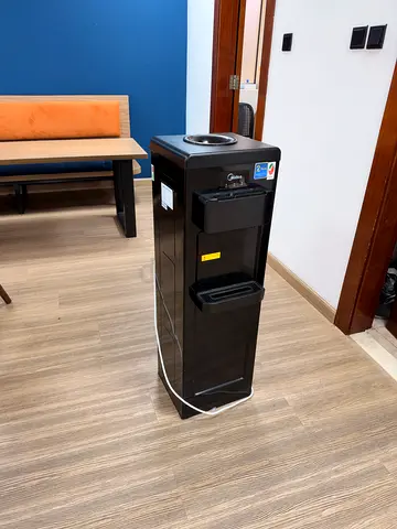 Black freestanding water cooler / dispenser - working condition