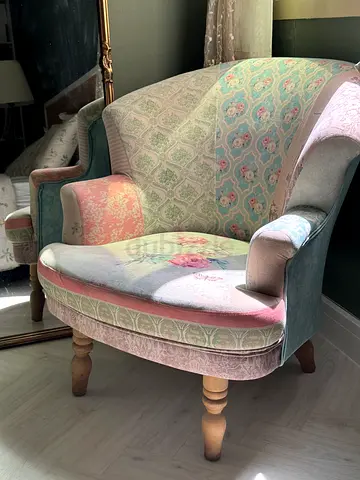 Vintage upholstered armchair — pastel patterned fabric