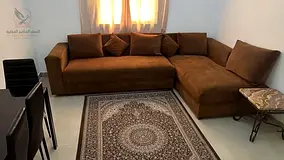 One-bedroom apartment for monthly rent, master bedroom, fully equipped kitchen, in Ajman behind Thim