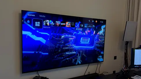 77-inch LED Smart TV mounted, good working condition