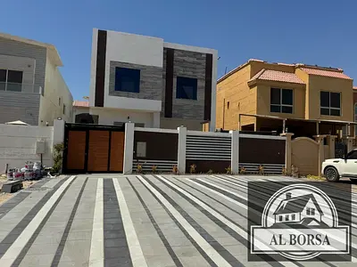 For sale: A five-bedroom villa with a master suite, separate majlis, living room, and an external annex with a kitchen and outdoor seating area in Al