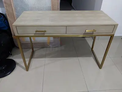 Slim console table with drawers and gold metal legs
