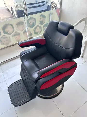 5 Black leather barber chairs with red accents – good condition