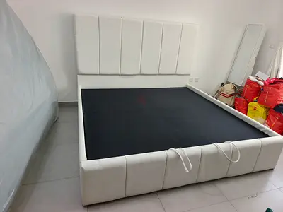 White upholstered queen size bed frame with hydraulic