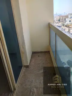 One-bedroom apartment for annual rent in Al Rawda 1, Ajman. Balcony, 2 bathrooms, spacious layout, A