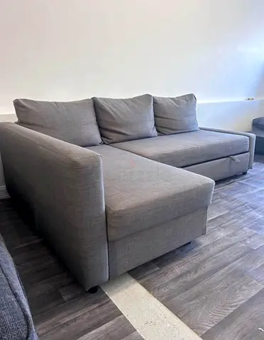 Light grey L-shaped corner sofa with chaise — good condition