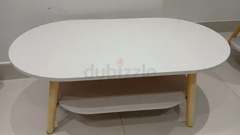 White Oval Coffee Table with Lower Shelf and Wooden Legs