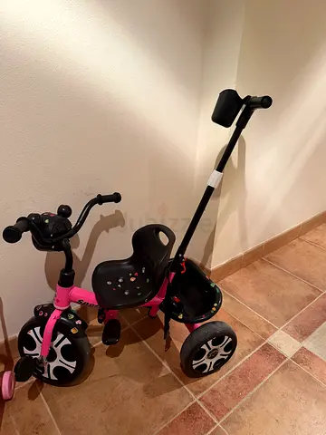Pink toddler tricycle with parent push handle - good condition