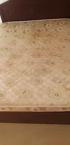 Used queen mattress with cover - good condition