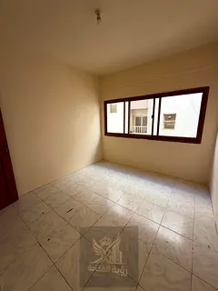 2 Bedroom Hall for annual rent in Al Butina, behind Nesto Sharjah. Central AC, 1 bathroom, excellent