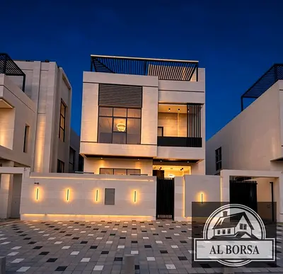 For sale in Al Helio 1, Ajman: A villa featuring 5 master bedrooms, a majlis, a living area, a kitchen, a maid's room, and a swimming pool.