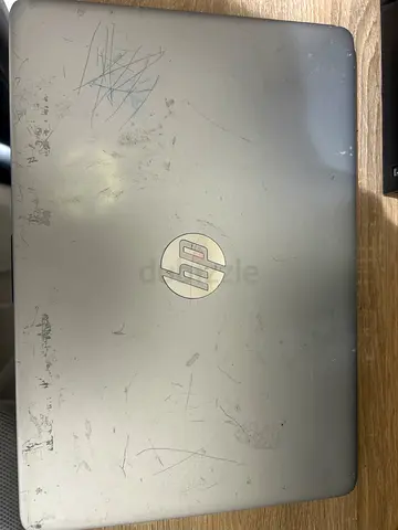 Used HP Laptop - Silver, Scratched Top Cover, working completely fine comes with original charger