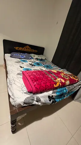 Single bed frame with mattress and bedding