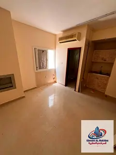Large studio in Al Butina with separate kitchen, split AC, central gas, glass windows, natural light
