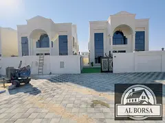 For sale in Al Helio 2, Ajman: a villa with 5 master bedrooms, a majlis, two living rooms, two kitch