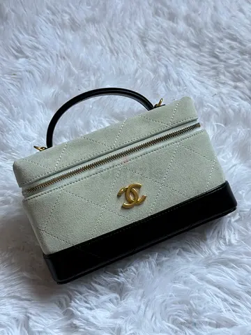 Chanel-style quilted top-handle vanity bag – cream & black