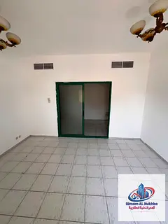 Huge studio like a 1BR in Al Qasimia Al Soor. Sep kitchen, balcony, central AC/gas, near Mega Mall,
